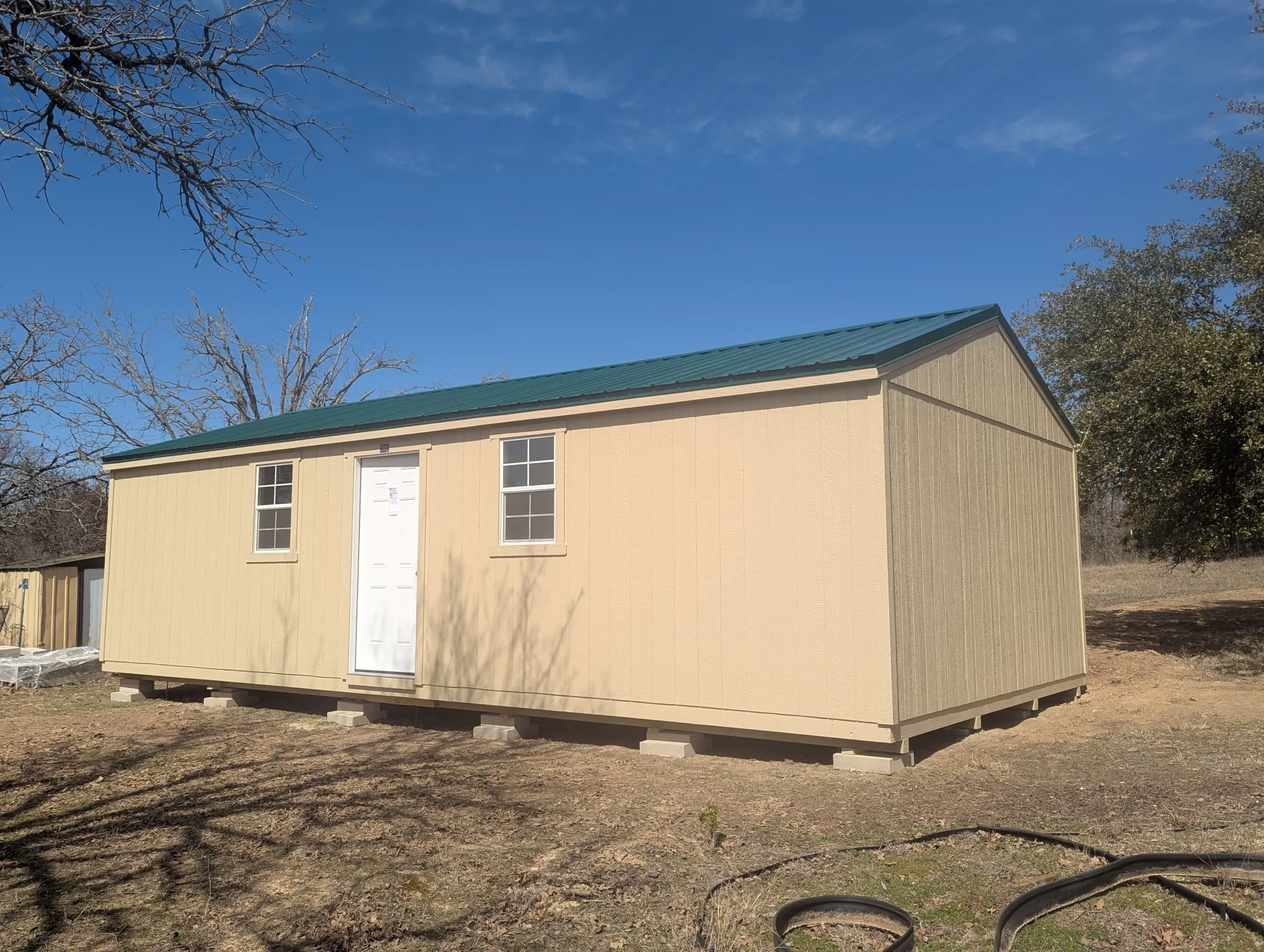 Customer of SE Yard Solutions with their 16x32 storage shed in Azle