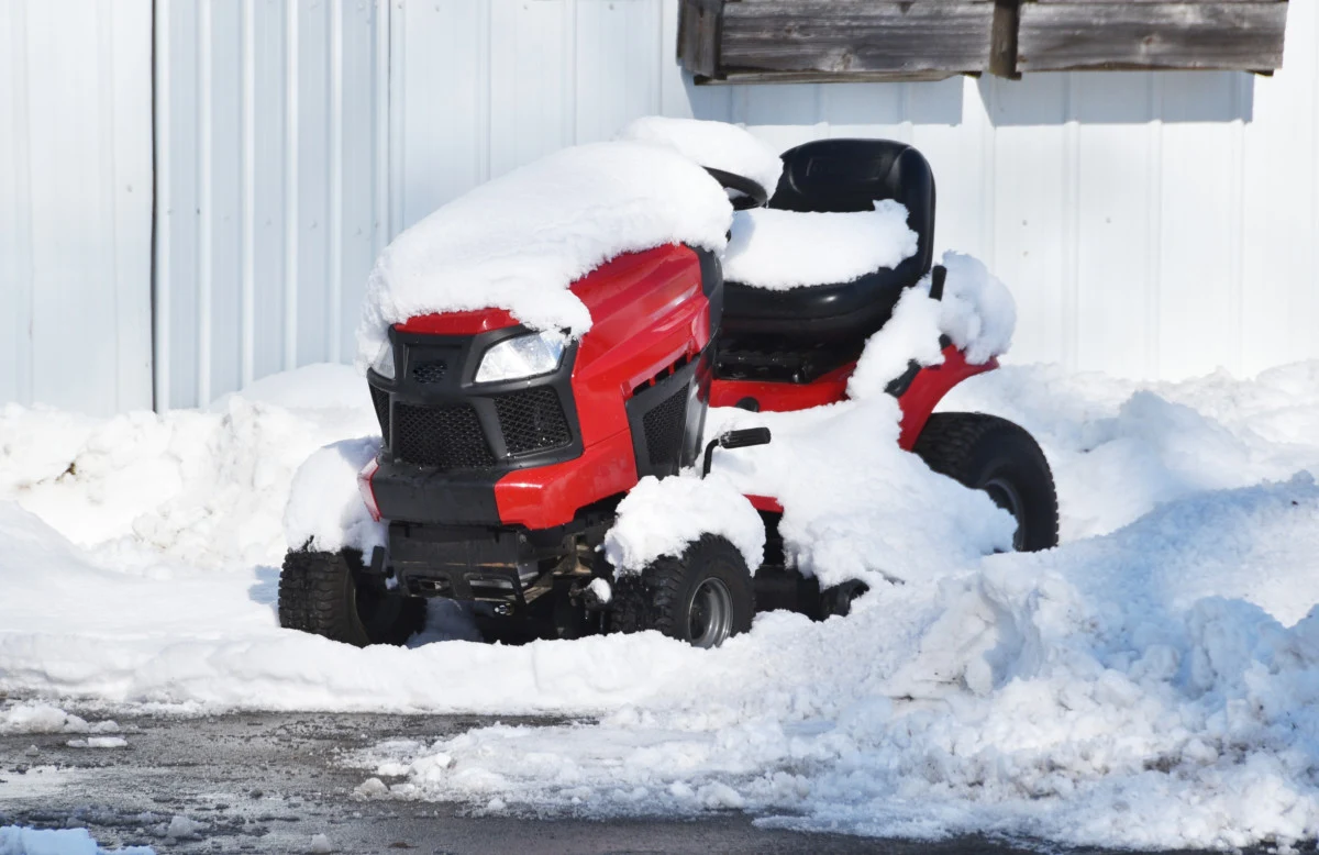 Organized shed interior with lawn equipment properly stored for winter
