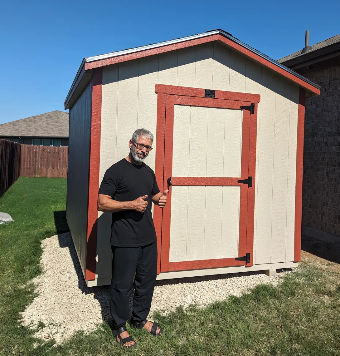 Customer of SE Yard Solutions with their 10x16 backyard shed in Fort Worth