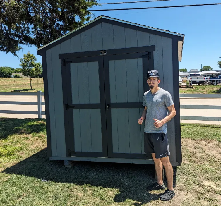 Customer of SE Yard Solutions with their 10x16 backyard shed in Azle