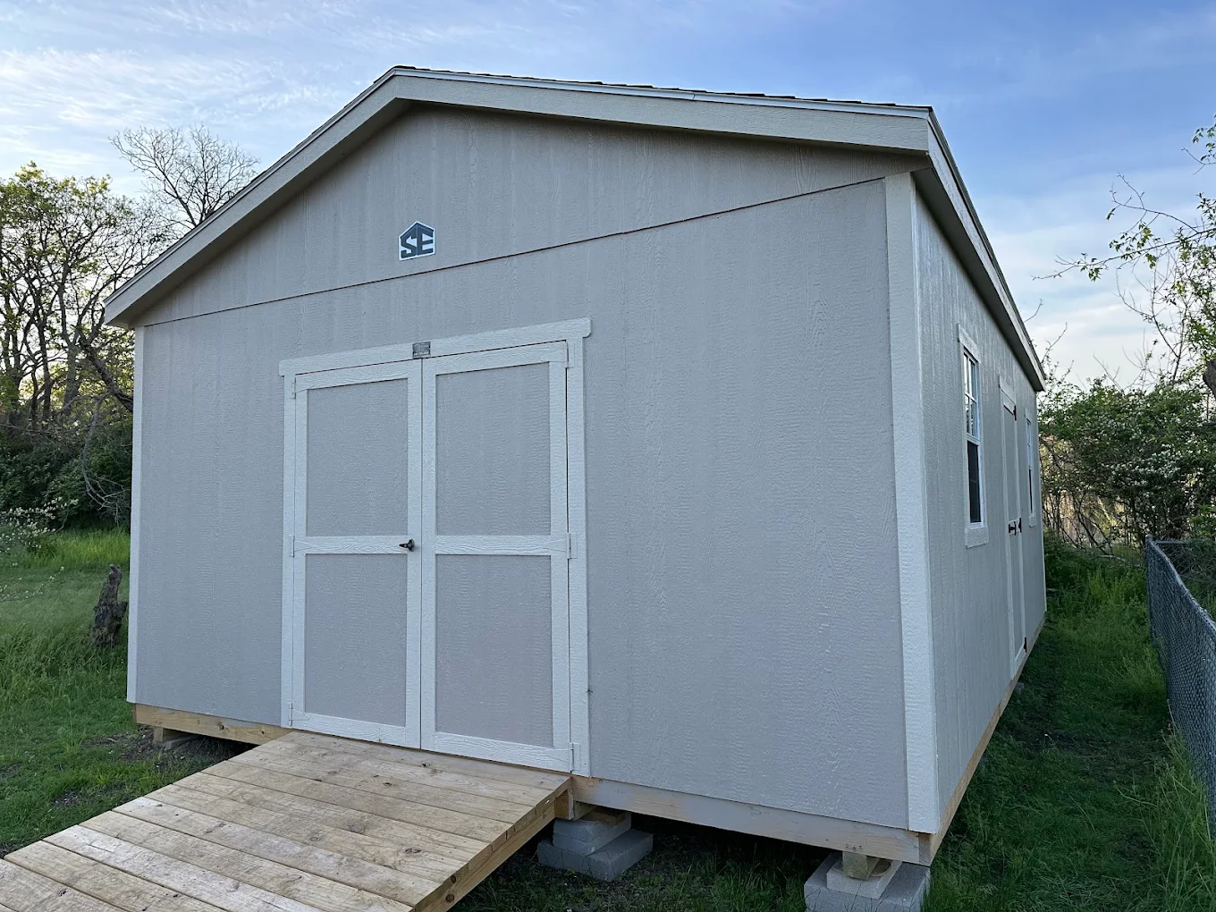 Customer of SE Yard Solutions with their 10x16 backyard shed in Bowie